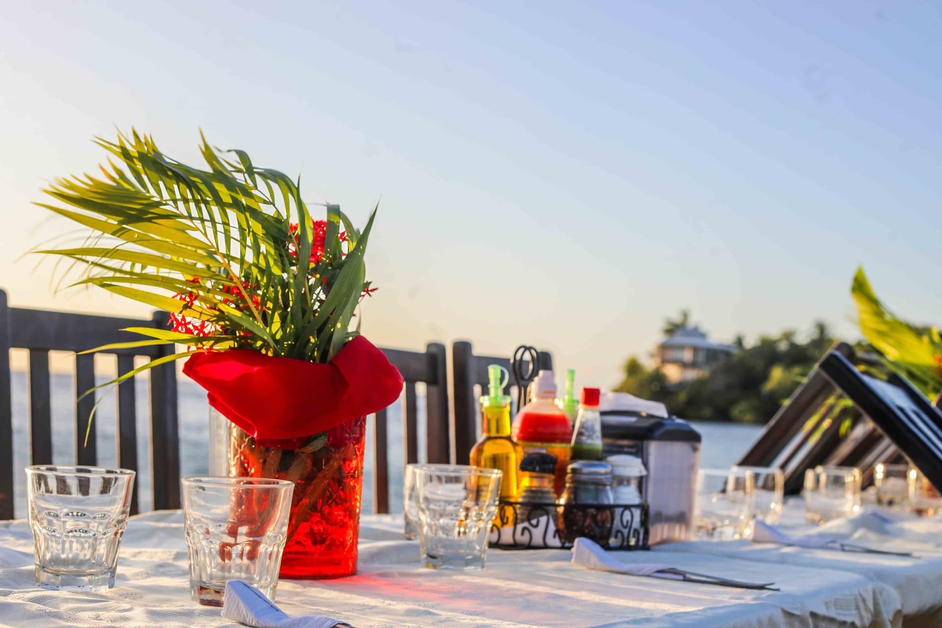 A dockside table set for dinner at golden hour, Splash Inn